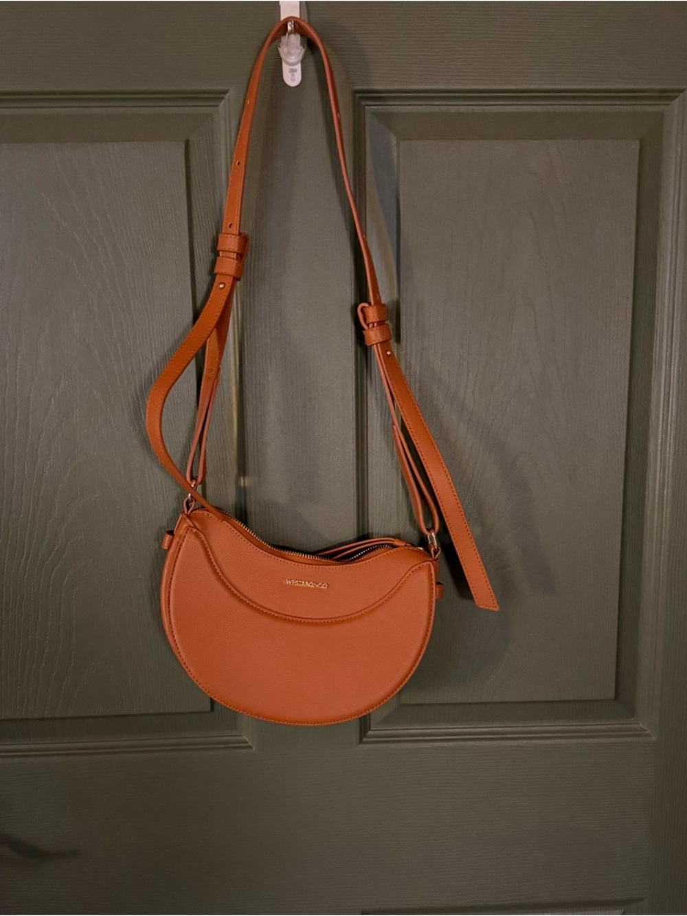 Crescent shaped crossbody bag